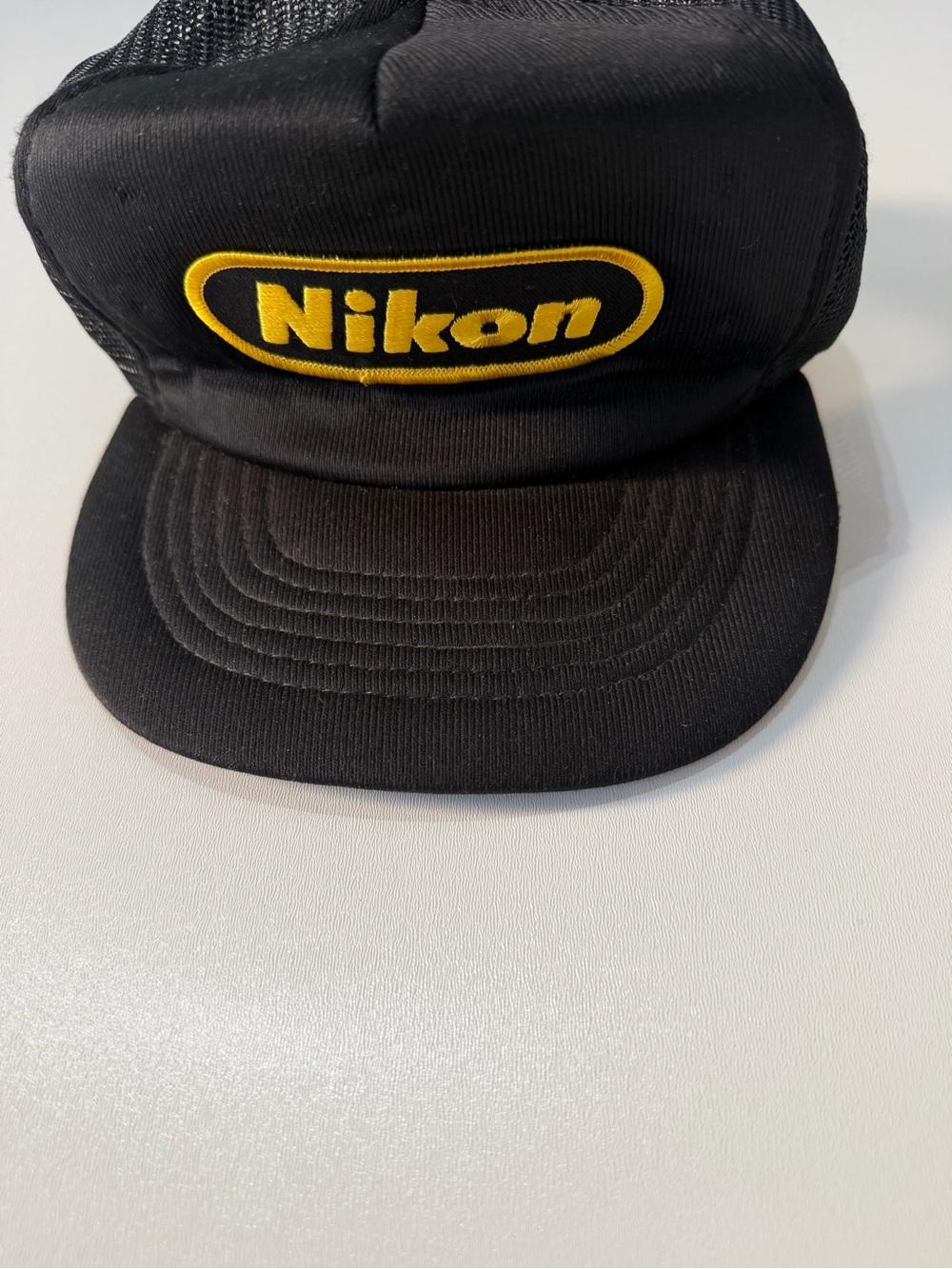 Vintage Nikon Black Trucker Cap with Yellow Logo